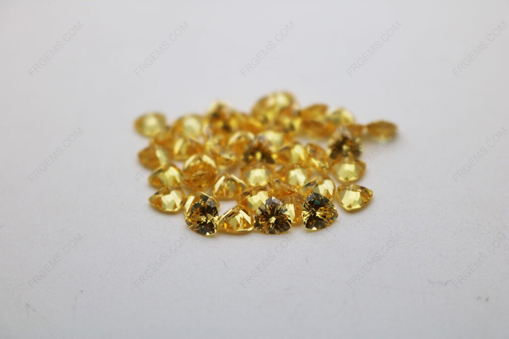 Cubic_Zirconia_Golden_Yellow_Trillion_Shape_Diamond_faceted_cut_5x5mm_stones_IMG_4898