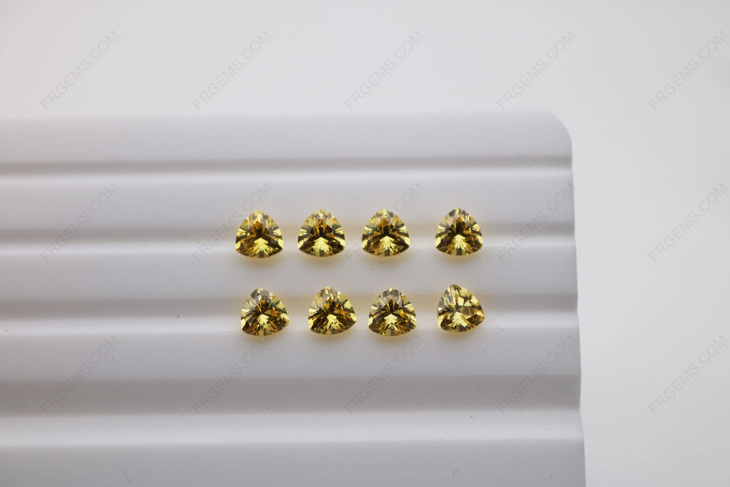 Cubic_Zirconia_Golden_Yellow_Trillion_Shape_Diamond_faceted_cut_5x5mm_stones_IMG_4900