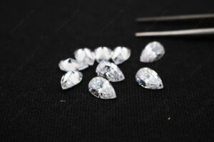 Pear-faceted-stones-with-drilled-holes-White-CZ-Color-gemstones-China-Supplier