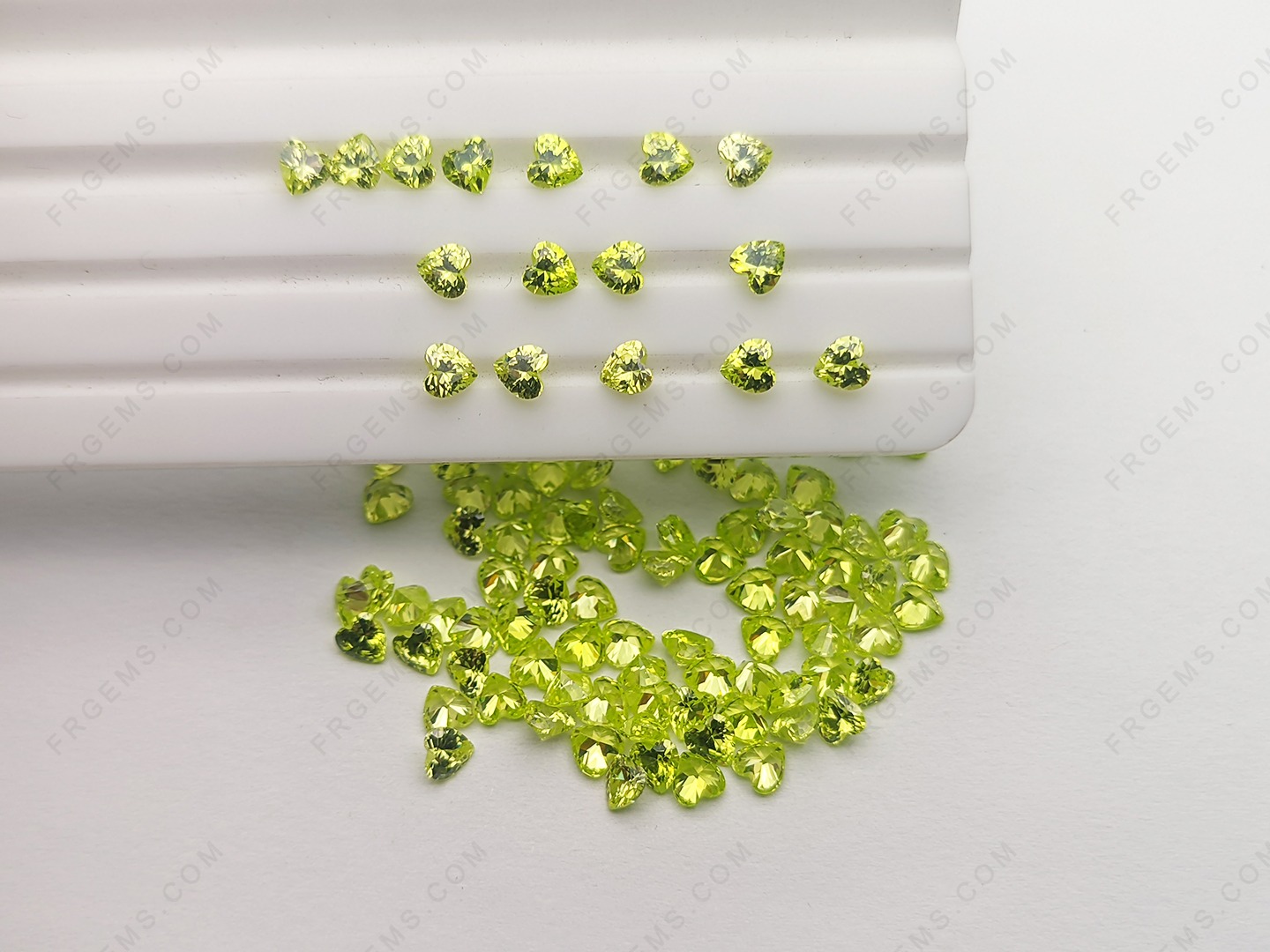 Buy Heart Shaped Faceted Cut Loose Cubic Zirconia Apple Green Color 4x4mm gemstones wholesale